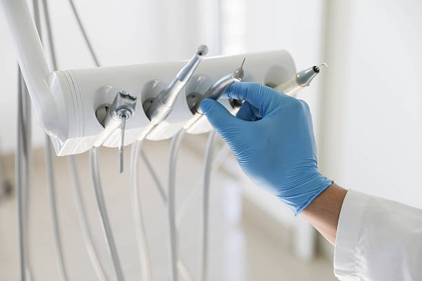 Professional Emergency Dentist technician working in DeWitt, MI